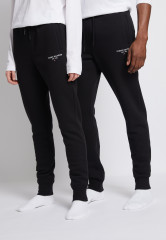 Tommy Hilfiger LOGO SWEATPANTS UNISEX Tracksuit bottoms black СПОРТИВНЫЕ БРЮКИ С ЛОГОТИПОМ УНИСЕКС Спортивные штаны черный